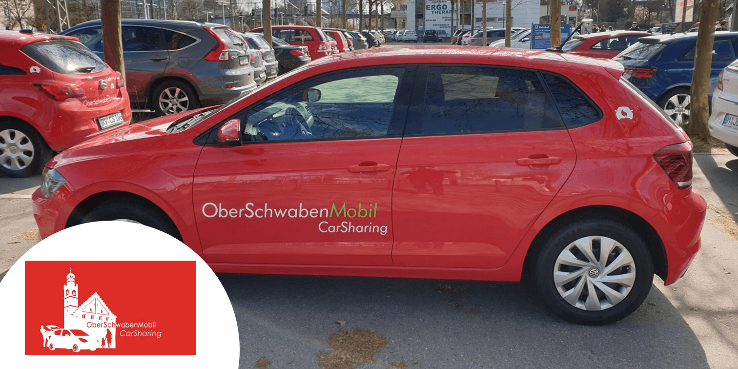 Red car and logo of the carsharing partner OberSchwabenMobil.